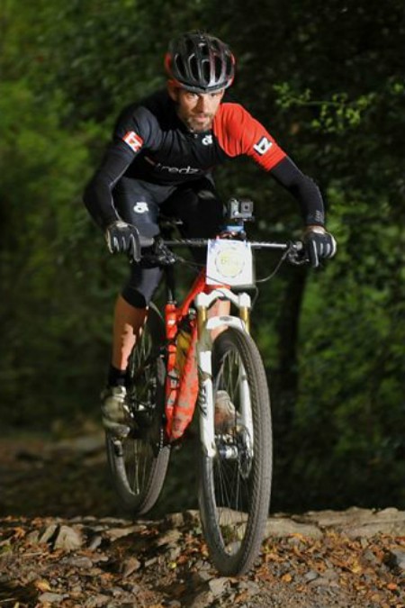 Scott tackles the terrain on his MTB